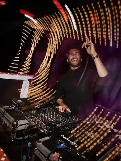 A shot from a fantastic wedding afterparty in Goa. I use creative lighting and a dynamic setlist to make sure the celebration is visually stunning and keeps everyone dancing all night. This is what a professional wedding DJ set looks like.
