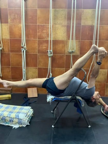 A reclining leg stretch on a chair.