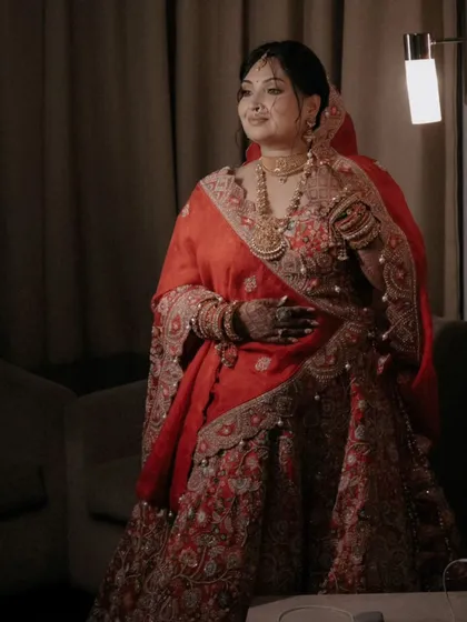 A full-length portrait of Shalini, her pose elegant and her expression full of quiet confidence.