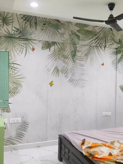 For this bedroom, I installed a subtle tropical leaf mural that appears to cascade down from the ceiling. The soft green and grey tones create a peaceful and restful environment, perfect for a sleeping space.