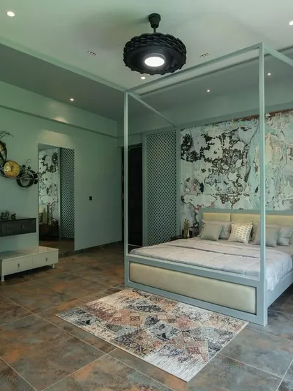 A duplicate of 148, this image shows the artistic bedroom's layout, which includes a comfortable pink rocking chair, creating a cozy reading nook.