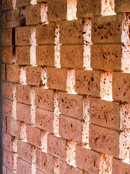This image highlights the use of indigenous materials in my projects. The image shows a detail of a brick jali, or screen, which allows for natural ventilation while creating a beautiful play of light and shadow.