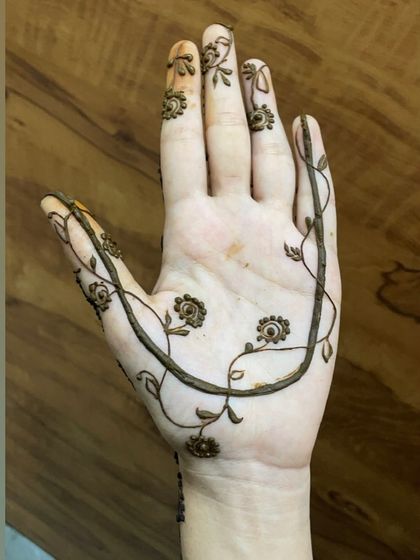 A close-up of the minimal vine design, showing its delicate and graceful lines.