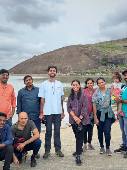 The group enjoying the view by the lake at Mandaragiri.