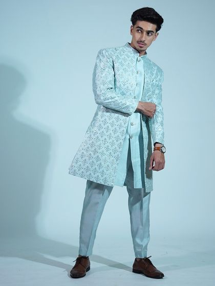 Traditional, but make it trendy. This light blue sherwani with intricate embroidery is a modern take on classic Indian menswear.