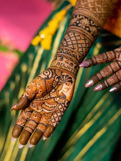A detailed photograph of the bride's full mehendi design, showcasing the incredible artistry from the palm to the elbow.