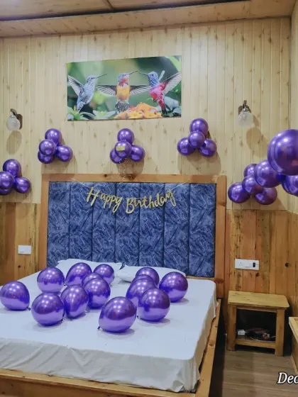 A full room view of the simple birthday setup. The balloons are arranged to create a balanced and festive look without overwhelming the space.