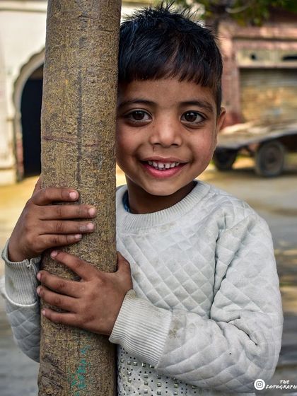 A slightly different edit of the same joyful moment. Playing with color and tone can bring out different feelings in a portrait, and I often create multiple versions to find the perfect one.
