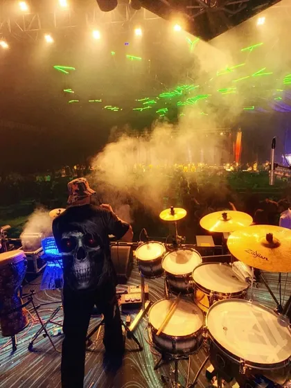 A view from my console. This is my zone, surrounded by my full drum and percussion kit, with smoke and lasers filling the air. This setup allows me to bring a stadium-level concert feel to your event.