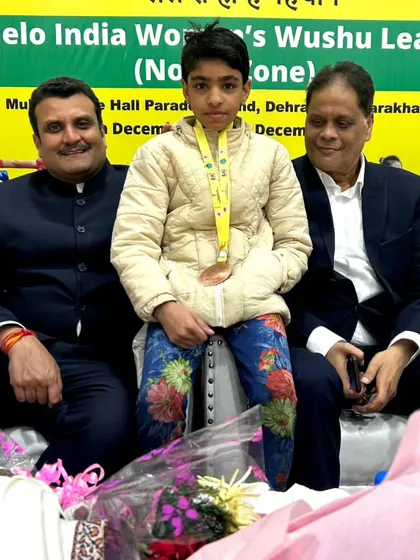 Posing with one of my young champions at the Khelo India Women's Wushu League. Her medal is a symbol of her dedication and the high standards of our academy.