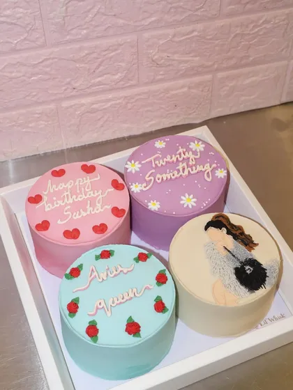 Celebrating birthdays in style with this dreamy set of four personalized bento cakes, each with its own unique design and color palette.