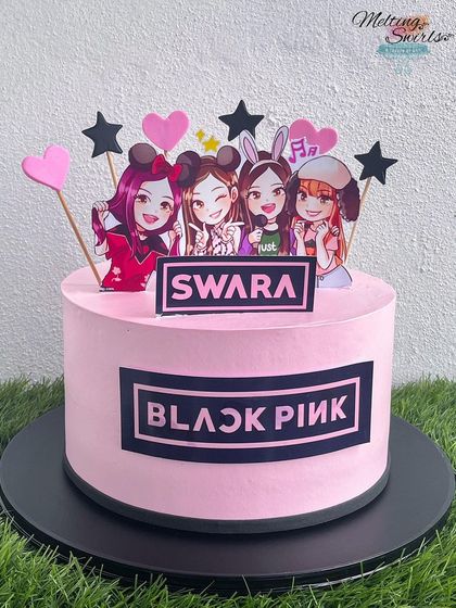 Blackpink in your area! This cake is for the K-pop fans, featuring the iconic Blackpink logo and cute cartoon toppers of the group members.
