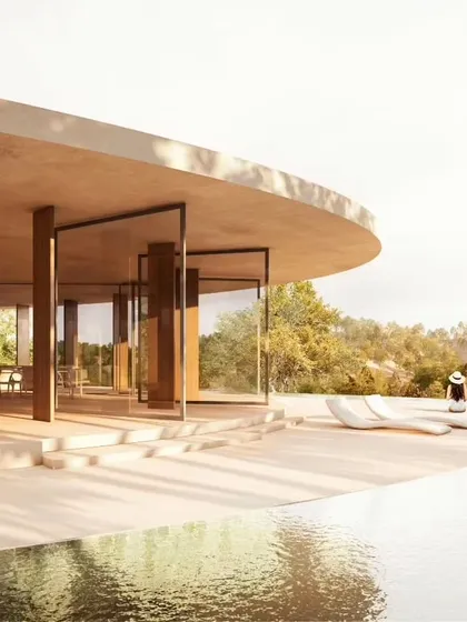 The open-air dining and lounge area at Amar Villa, offering panoramic views and a direct connection to the infinity pool and the landscape beyond.
