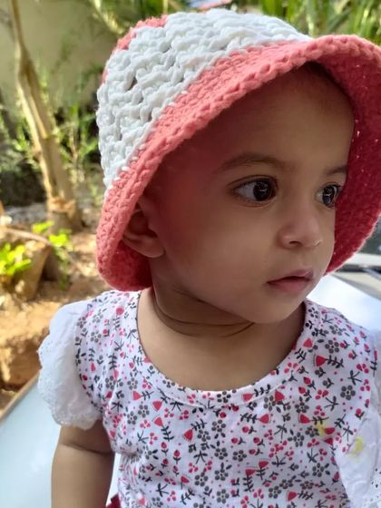 Another sweet photo of my daughter in her sunhat. The hat is designed to be comfortable and stay on, even on a breezy day.