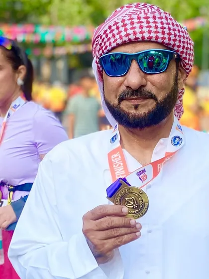 A close-up of a member with his medal. The intricate design of the medal is a work of art.