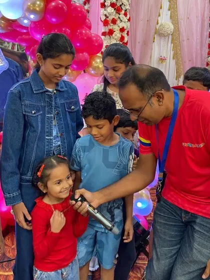 The birthday girl gets her moment on the microphone. We make sure the star of the day feels special, encouraging them to lead and share their excitement with friends.