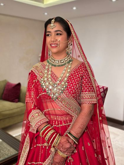 Priya looking absolutely lovely for her wedding. We chose a soft glam look with a subtle smokey eye and a nude pink lip to complement her red lehenga.