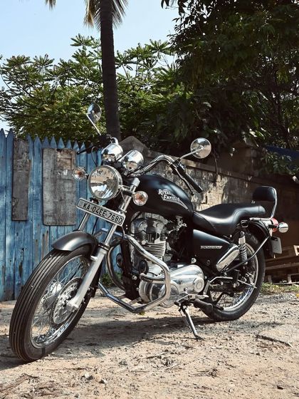 Another angle of the restored Thunderbird, showcasing its classic cruiser lines against a rustic backdrop.