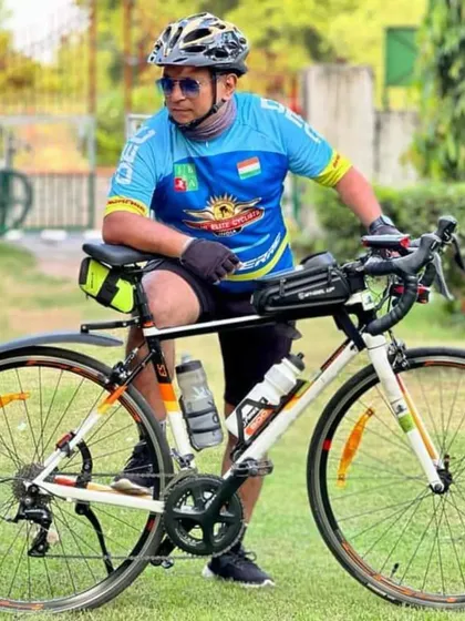 A member posing with his bike. He is a powerhouse and an inspiration to many.