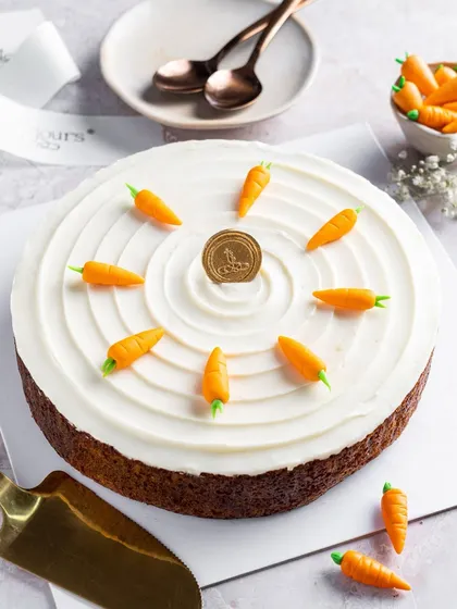 Our classic Carrot Cake, simply decorated with a swirl of cream cheese frosting and adorable miniature marzipan carrots. It’s a timeless favourite, made fresh for you to enjoy any day of the week.