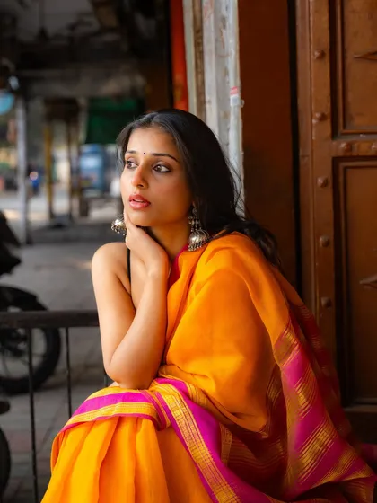 A moment of quiet thought on a city stoop. This type of environmental portrait tells a story and feels very genuine.