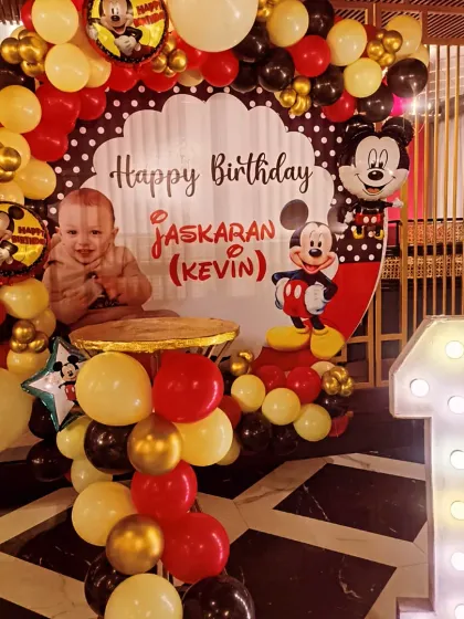 A first birthday is a precious moment, and I loved bringing this classic Mickey Mouse theme to life for little Jaskaran. The setup included a personalized backdrop, a full balloon arch in signature red, yellow, and black, and a light-up number '1' to make the celebration extra special.
