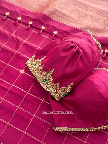 Another view of the magenta velvet blouse, showing the delicate tassels on the back.