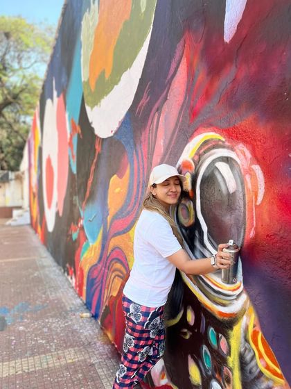 Hugging my spray can. A fun moment captured during the intense, multi-day painting session at IIT Bombay.