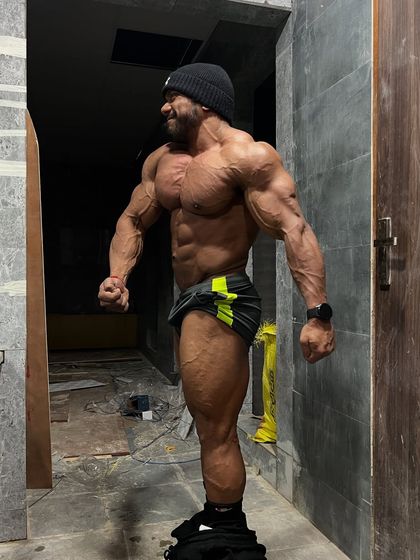 Prep files. Real growth starts when you're tired of your own excuses. A side pose showing extreme conditioning.