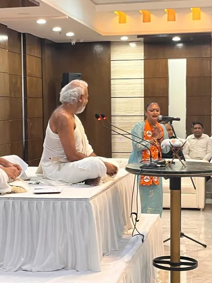An MLA addresses the gathering from a side podium. I ensure that every speaker, whether on the main stage or at a secondary lectern, has a high quality microphone and clear audio delivery.