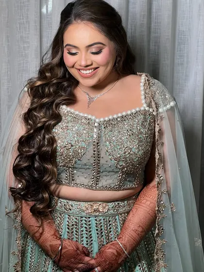 Here is a glamorous hairstyle for a Sagan and Sangeet night. I created voluminous, cascading waves that have beautiful movement and hold their shape, perfect for a night of celebration and dancing.