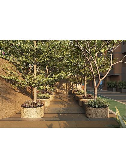 We create immersive experiences like this walkway through a dense grove of trees, providing a refreshing, nature-filled transition within the residential complex.