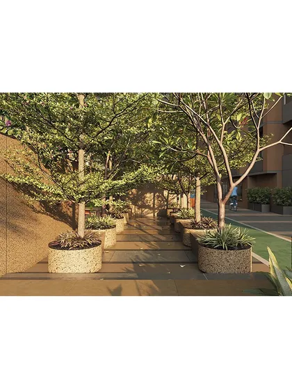 We create immersive experiences like this walkway through a dense grove of trees, providing a refreshing, nature-filled transition within the residential complex.