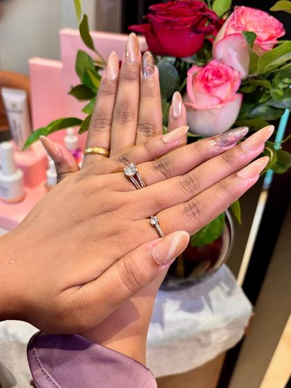 The chrome accents on these nude almond nails catch the light beautifully. It’s a sophisticated way to add some sparkle to your manicure.