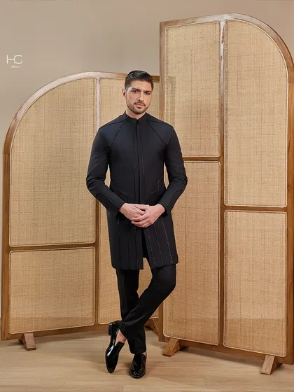 This longline achkan is designed for owning the night. The sharp tailoring and minimalist design create an aura of evening elegance and sophisticated power.