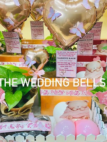 The details make the gift. Each birth announcement hamper includes a personalized card, a teddy bear, and other sweet touches.