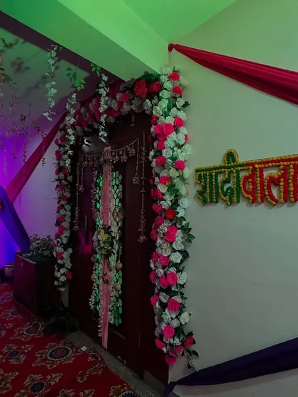 A 'Shaadi Wala Ghar' sign made of flowers placed in the hallway, adding a personalized touch to the home decoration.