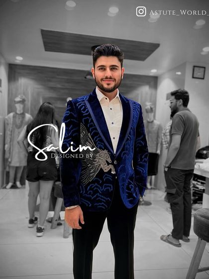 A client wearing the royal blue velvet Pegasus blazer. The color is vibrant and the design is unique, ensuring you'll stand out in any crowd.