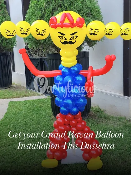 A grand Ravan balloon installation for a Dussehra celebration. This towering sculpture, with its ten heads, was custom-designed to be a bold and festive statement piece for an outdoor event.