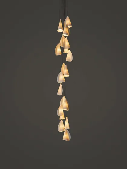 A long, cascading installation of the Bocci 21 series, its form elegantly spiraling downwards.