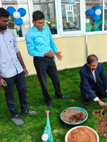 Our team member guides a client during the ceremonial planting, symbolizing the collaborative partnership we build with every corporate client.