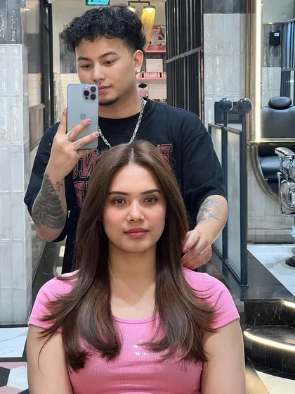 A selfie with my client showing off her new butterfly haircut. The layers frame her face beautifully and add so much life to her hair.