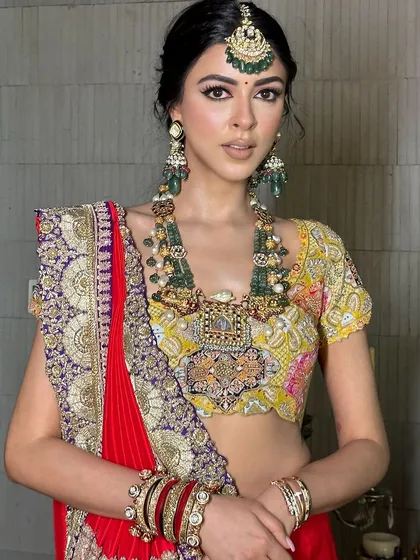 You look like a goddess. This royal look is defined by the sharp wing liner, which balances the heavy traditional jewelry.