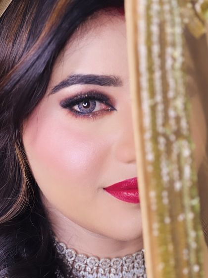 A creative half-face shot of my reception bride, showing off her stunning eye makeup and flawless skin.