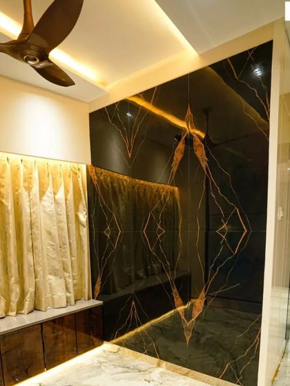 Book-matched tiles create a stunning, symmetrical pattern that can turn a simple wall into a work of art. Here, I used them to create a dramatic and luxurious feature wall in the living area.