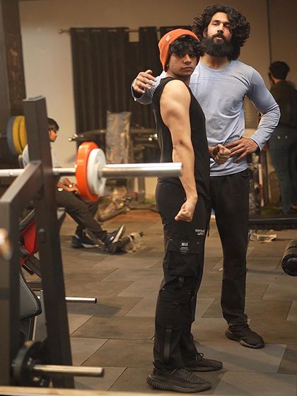 Here I am guiding my client through his workout. Personal attention and correct form are key components of my coaching program.