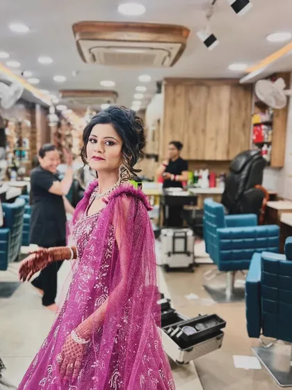 A wider view of the magenta gown look, captured in our salon. This shows how we create looks that are perfect for making a statement at any party or reception.