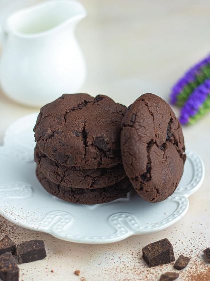 A stack of my classic double chocolate cookies. They are rich, soft, and available for quick delivery on Swiggy for when those cravings hit.