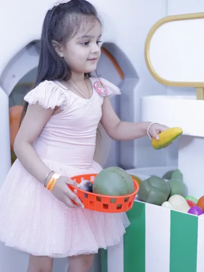 Our pretend grocery store is a hit for imaginative play, where kids can shop for healthy fruits and vegetables.