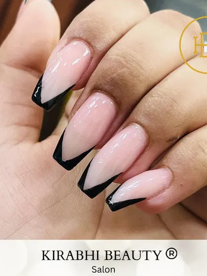 A modern take on a classic. This is a V-shaped French manicure using a bold black tip on a neutral pink base. It’s a chic and sophisticated design that works for any occasion.